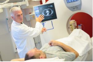 Doctor showing patient imaging test result.