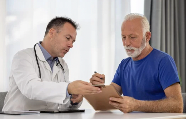 Man speaking with doctor. 
